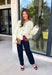 A classic cardigan is a wardrobe staple you'll wear year after year, and this timeless style from Double Zero is the perfect addition to your collection. Designed in a soft cream knit, this cozy cardigan features beautiful tortoise buttons that add a warm, elevated touch to its classic silhouette. Ribbed detailing at the neckline, hem, and cuffs creates a polished finish, while the soft knit keeps you comfortable all day long. 