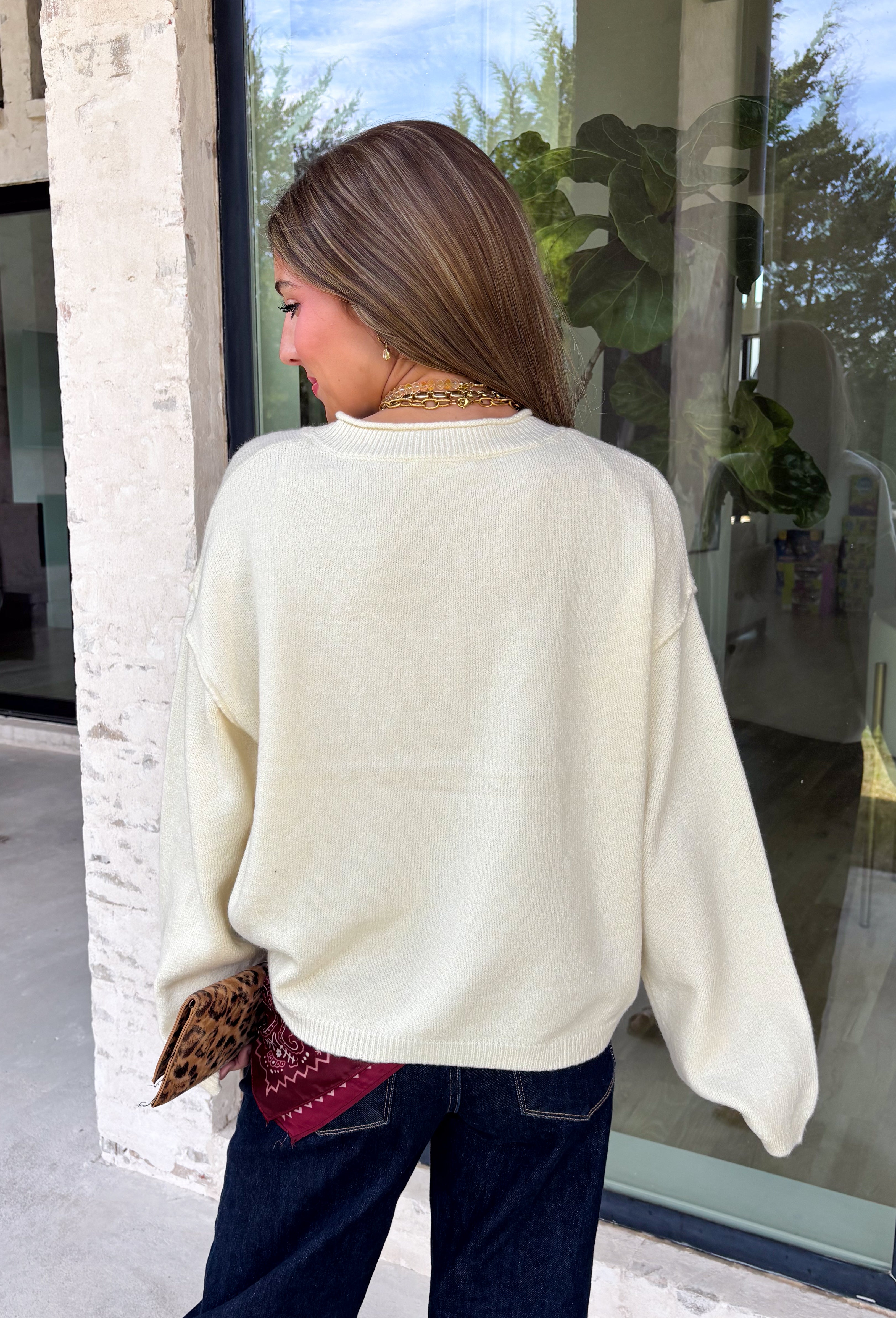 A classic cardigan is a wardrobe staple you'll wear year after year, and this timeless style from Double Zero is the perfect addition to your collection. Designed in a soft cream knit, this cozy cardigan features beautiful tortoise buttons that add a warm, elevated touch to its classic silhouette. Ribbed detailing at the neckline, hem, and cuffs creates a polished finish, while the soft knit keeps you comfortable all day long. 
