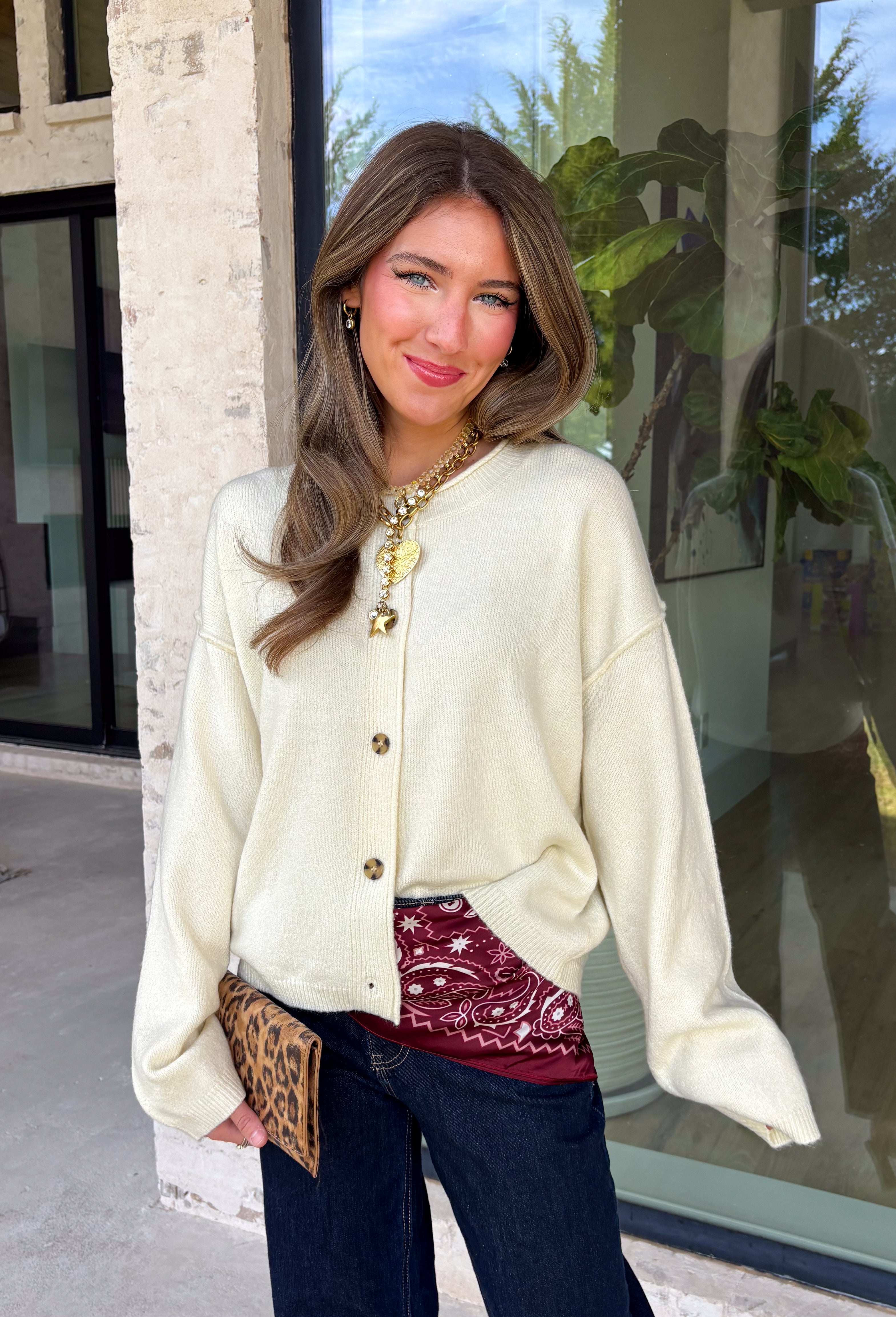 A classic cardigan is a wardrobe staple you'll wear year after year, and this timeless style from Double Zero is the perfect addition to your collection. Designed in a soft cream knit, this cozy cardigan features beautiful tortoise buttons that add a warm, elevated touch to its classic silhouette. Ribbed detailing at the neckline, hem, and cuffs creates a polished finish, while the soft knit keeps you comfortable all day long. 