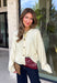 A classic cardigan is a wardrobe staple you'll wear year after year, and this timeless style from Double Zero is the perfect addition to your collection. Designed in a soft cream knit, this cozy cardigan features beautiful tortoise buttons that add a warm, elevated touch to its classic silhouette. Ribbed detailing at the neckline, hem, and cuffs creates a polished finish, while the soft knit keeps you comfortable all day long. 