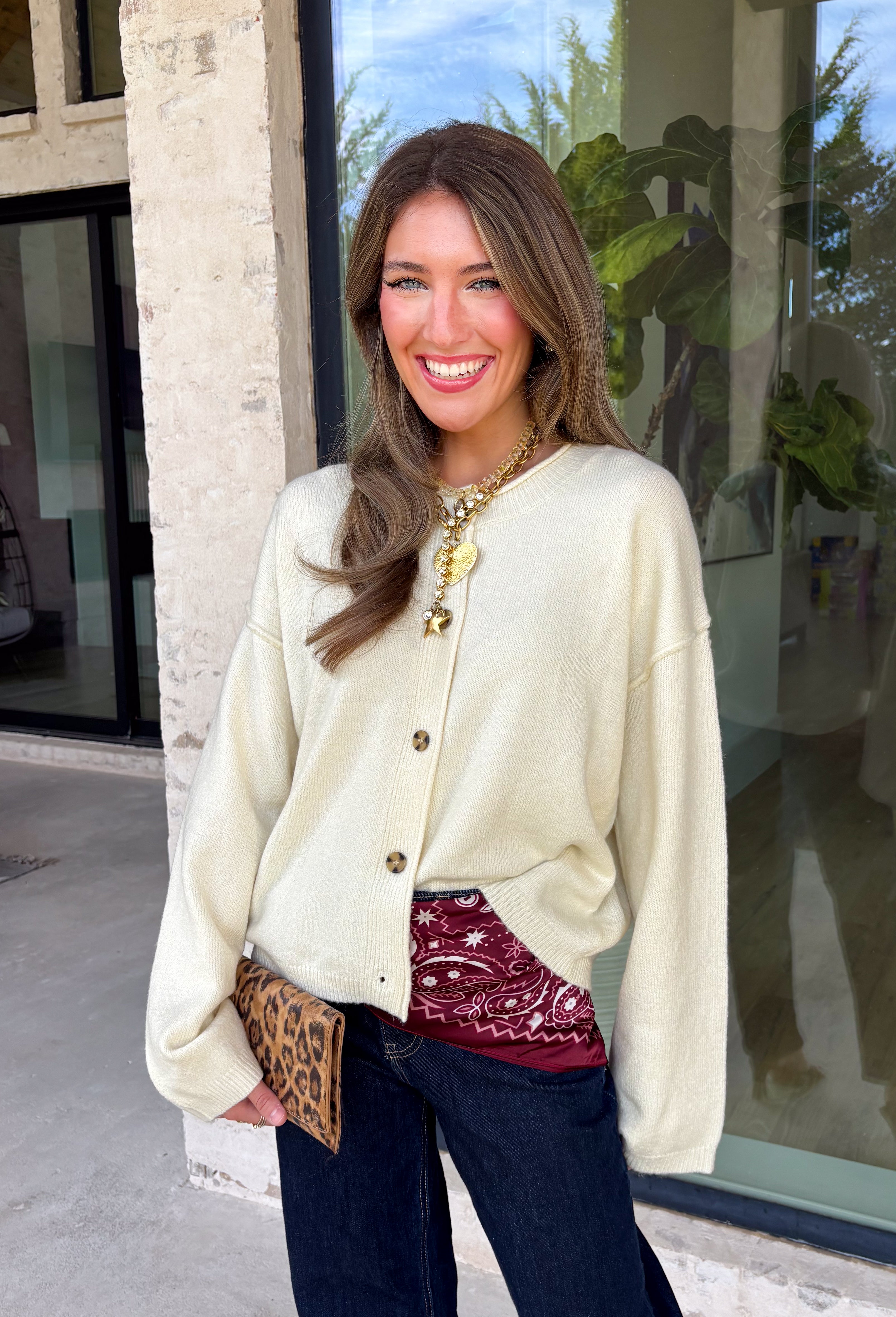 A classic cardigan is a wardrobe staple you'll wear year after year, and this timeless style from Double Zero is the perfect addition to your collection. Designed in a soft cream knit, this cozy cardigan features beautiful tortoise buttons that add a warm, elevated touch to its classic silhouette. Ribbed detailing at the neckline, hem, and cuffs creates a polished finish, while the soft knit keeps you comfortable all day long. 