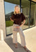 Wrap yourself in effortless fall style with this cozy brown short sleeve sweater! The rich autumn hue makes it a staple you'll reach for again and again, while the relaxed dolman sleeves create an easy, comfortable fit that's both flattering and timeless. Wide ribbed sleeve bands, a classic ribbed round neckline, and a ribbed hem add elevated finishing touches to this versatile knit. 