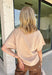 Wrap yourself in effortless fall style with this cozy oatmeal short sleeve sweater! This neutral autumn hue makes it a staple you'll reach for again and again, while the relaxed dolman sleeves create an easy, comfortable fit that's both flattering and timeless. Wide ribbed sleeve bands, a classic ribbed round neckline, and a ribbed hem add elevated finishing touches to this versatile knit. 