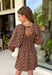 A classic leopard print never goes out of style, and this stunning dress is the perfect way to wear it this season. Designed with an effortlessly flattering silhouette, this timeless piece features a feminine square neckline and a beautiful open-back tie detail for an elevated touch. The smocked back provides a comfortable, flexible fit, while the long sleeves with smocked cuffs add soft volume and charm. 