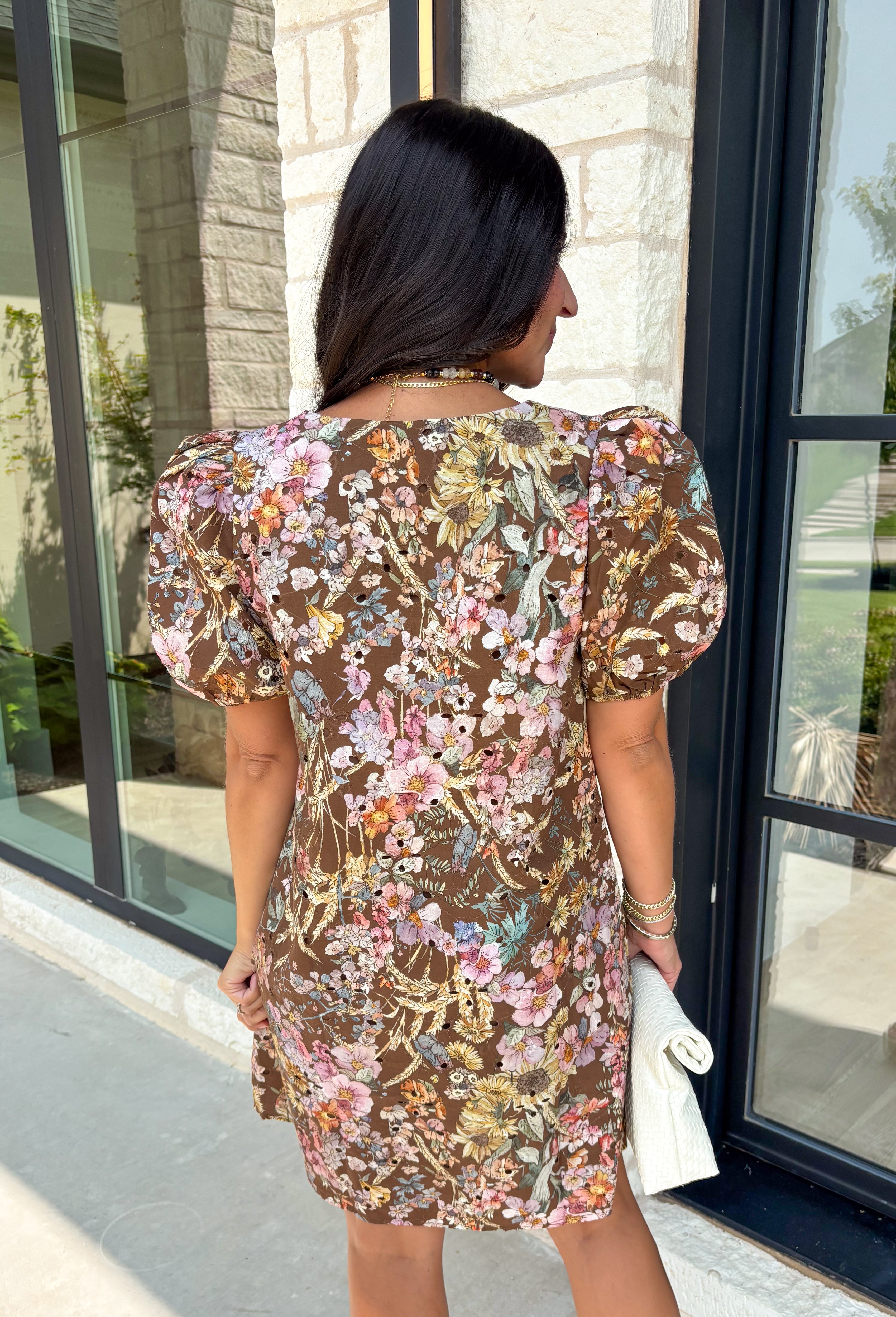 Timeless, feminine, and made for all your favorite fall moments, this eyelet dress is one you'll love wearing season after season! Crafted in a rich brown hue, this fully lined cotton dress features delicate eyelet lace detailing throughout for a beautifully textured look. The flattering square neckline and soft elastic puff sleeves add a romantic touch, while the button-front design and side pockets blend style with everyday practicality.