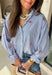 This blue and white stripe button down is the perfect blend of classic style and patriotic charm! Featuring embroidered American flags throughout, it adds a fun, festive touch while still feeling timeless and easy to wear. The collared neckline and button down design give it that effortless, polished look you can style for everything from backyard BBQs to fireworks and holiday weekends. Lightweight and breathable, it’s the perfect layer for all your summer celebrations. 