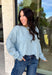 Wrap yourself in everyday comfort with this cozy sweater from Hyfve. Designed in a soft light blue hue, this timeless knit is elevated with a contrasting gray neckline for a subtle touch of detail. Exposed seam accents give it a relaxed, lived-in feel, while the ribbed hem and cuffs create a classic finish. Crafted from an ultra-soft knit, this versatile sweater is perfect for layering on crisp fall mornings or wearing on its own throughout the season.