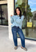 Wrap yourself in everyday comfort with this cozy sweater from Hyfve. Designed in a soft light blue hue, this timeless knit is elevated with a contrasting gray neckline for a subtle touch of detail. Exposed seam accents give it a relaxed, lived-in feel, while the ribbed hem and cuffs create a classic finish. Crafted from an ultra-soft knit, this versatile sweater is perfect for layering on crisp fall mornings or wearing on its own throughout the season.