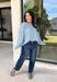 Wrap yourself in everyday comfort with this cozy sweater from Hyfve. Designed in a soft light blue hue, this timeless knit is elevated with a contrasting gray neckline for a subtle touch of detail. Exposed seam accents give it a relaxed, lived-in feel, while the ribbed hem and cuffs create a classic finish. Crafted from an ultra-soft knit, this versatile sweater is perfect for layering on crisp fall mornings or wearing on its own throughout the season.