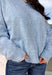Wrap yourself in everyday comfort with this cozy sweater from Hyfve. Designed in a soft light blue hue, this timeless knit is elevated with a contrasting gray neckline for a subtle touch of detail. Exposed seam accents give it a relaxed, lived-in feel, while the ribbed hem and cuffs create a classic finish. Crafted from an ultra-soft knit, this versatile sweater is perfect for layering on crisp fall mornings or wearing on its own throughout the season.