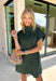 This forest green short sleeve dress is the perfect, effortless piece your fall wardrobe needs! The hidden button down design keeps the look clean and elevated, giving it that easy shirt dress feel you can dress up or down. Whether you're heading to lunch, work, or weekend plans, this dress brings the perfect pop of color. Just add some mules or sneakers and you’re set—don’t miss this one!
