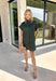 This forest green short sleeve dress is the perfect, effortless piece your fall wardrobe needs! The hidden button down design keeps the look clean and elevated, giving it that easy shirt dress feel you can dress up or down. Whether you're heading to lunch, work, or weekend plans, this dress brings the perfect pop of color. Just add some mules or sneakers and you’re set—don’t miss this one!