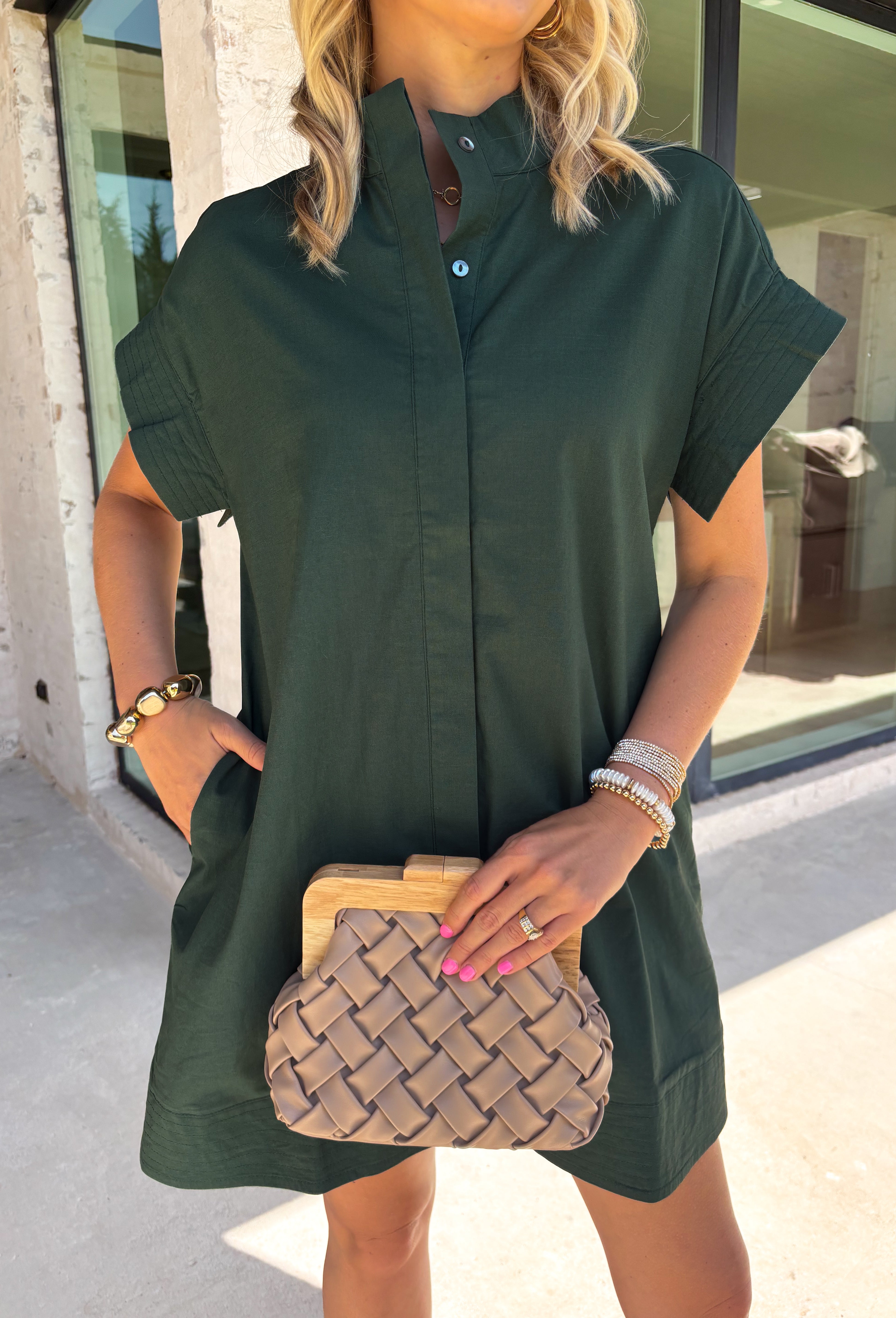 This forest green short sleeve dress is the perfect, effortless piece your fall wardrobe needs! The hidden button down design keeps the look clean and elevated, giving it that easy shirt dress feel you can dress up or down. Whether you're heading to lunch, work, or weekend plans, this dress brings the perfect pop of color. Just add some mules or sneakers and you’re set—don’t miss this one!