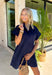 This navy short sleeve dress is the perfect, effortless piece your summer wardrobe needs! Made from a breathable cotton-linen blend, it’s lightweight and perfect for staying cool while still looking put together. The hidden button down design keeps the look clean and elevated, giving it that easy shirt dress feel you can dress up or down. Whether you're heading to lunch, work, or weekend plans, this dress brings the perfect pop of color. Just add sandals or sneakers and you’re set—don’t miss this one!
