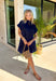 This navy short sleeve dress is the perfect, effortless piece your summer wardrobe needs! Made from a breathable cotton-linen blend, it’s lightweight and perfect for staying cool while still looking put together. The hidden button down design keeps the look clean and elevated, giving it that easy shirt dress feel you can dress up or down. Whether you're heading to lunch, work, or weekend plans, this dress brings the perfect pop of color. Just add sandals or sneakers and you’re set—don’t miss this one!