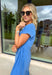 This blue short sleeve midi dress is the kind of effortless piece that makes summer styling so easy! Made from lightweight, breathable cotton, it’s perfect for warm days when you want to feel comfortable but still look put together. The tie details at each hip add a flattering, adjustable touch that gives shape while keeping things relaxed. With its easy midi length and throw-on-and-go feel, this is the dress you’ll reach for on repeat—from casual days to dinner plans. 