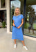 This blue short sleeve midi dress is the kind of effortless piece that makes summer styling so easy! Made from lightweight, breathable cotton, it’s perfect for warm days when you want to feel comfortable but still look put together. The tie details at each hip add a flattering, adjustable touch that gives shape while keeping things relaxed. With its easy midi length and throw-on-and-go feel, this is the dress you’ll reach for on repeat—from casual days to dinner plans. 