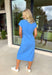 This blue short sleeve midi dress is the kind of effortless piece that makes summer styling so easy! Made from lightweight, breathable cotton, it’s perfect for warm days when you want to feel comfortable but still look put together. The tie details at each hip add a flattering, adjustable touch that gives shape while keeping things relaxed. With its easy midi length and throw-on-and-go feel, this is the dress you’ll reach for on repeat—from casual days to dinner plans. 