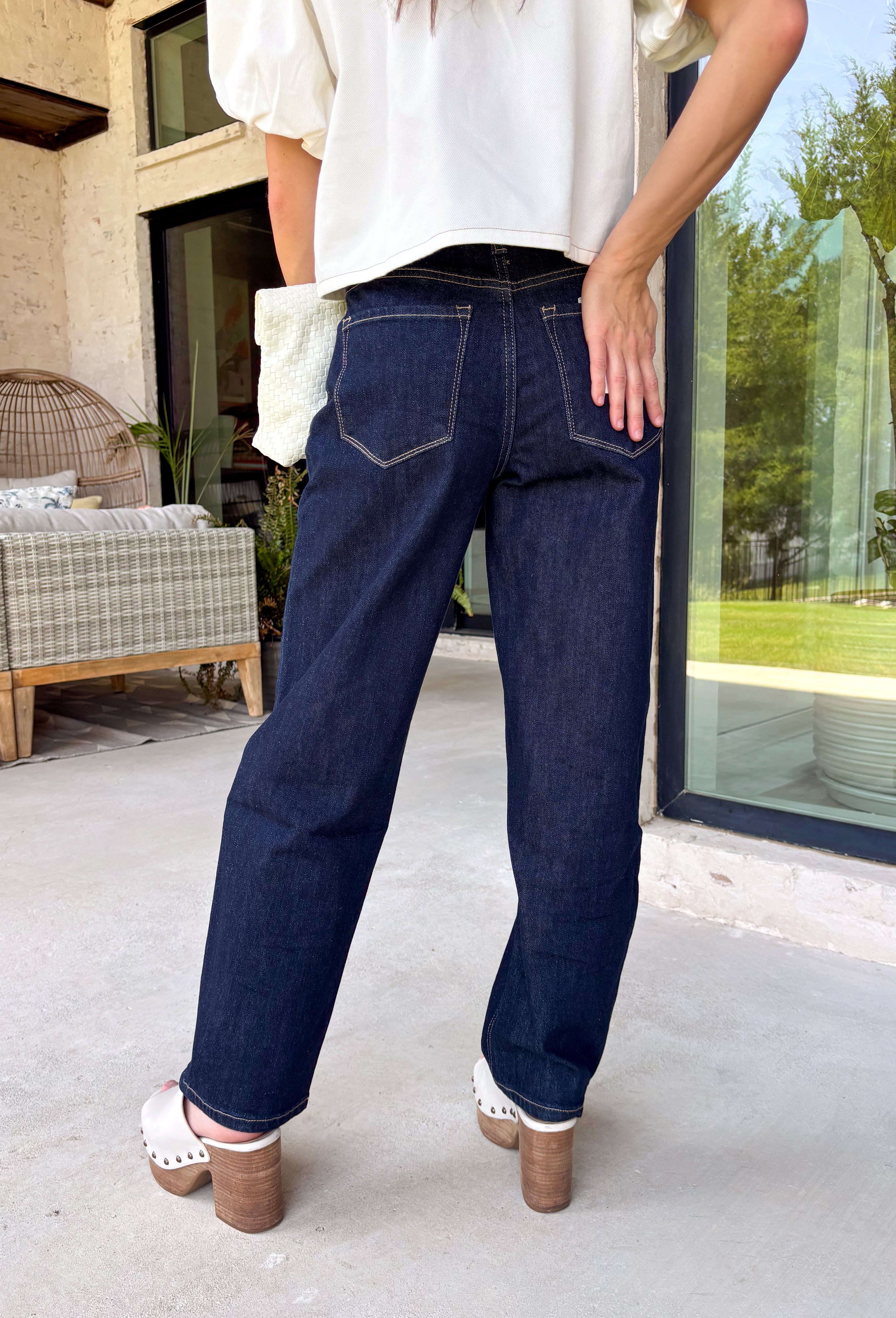 Meet your new favorite everyday denim! These dark wash slim barrel jeans combine the trend-forward barrel silhouette with a more streamlined fit, creating a look that's both modern and incredibly wearable. The flattering high-rise waist offers all-day comfort while helping create a polished silhouette, and the rich dark wash makes them easy to dress up or down.