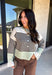 Wrap yourself in cozy comfort with this charming cardigan from Entro. Designed with a soft ecru knit and classic brown stripes, this timeless sweater gets a fresh pop of color from mint trim along the neckline, hem, and cuffs. The button-front design makes it easy to wear open over your favorite basics or buttoned up as a sweater, while the ultra-soft knit blend keeps you warm and comfortable all season long. 