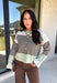 Wrap yourself in cozy comfort with this charming cardigan from Entro. Designed with a soft ecru knit and classic brown stripes, this timeless sweater gets a fresh pop of color from mint trim along the neckline, hem, and cuffs. The button-front design makes it easy to wear open over your favorite basics or buttoned up as a sweater, while the ultra-soft knit blend keeps you warm and comfortable all season long. 