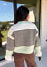 Wrap yourself in cozy comfort with this charming cardigan from Entro. Designed with a soft ecru knit and classic brown stripes, this timeless sweater gets a fresh pop of color from mint trim along the neckline, hem, and cuffs. The button-front design makes it easy to wear open over your favorite basics or buttoned up as a sweater, while the ultra-soft knit blend keeps you warm and comfortable all season long. 