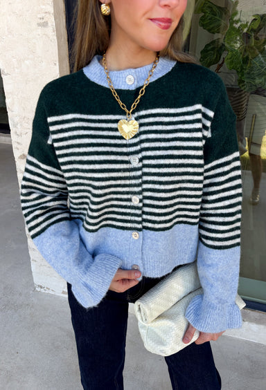 Wrap yourself in cozy comfort with this charming cardigan from Entro. Designed with a soft hunter knit and classic off white stripes, this timeless sweater gets a fresh pop of color from a light blue trim along the neckline, hem, and cuffs. The button-front design makes it easy to wear open over your favorite basics or buttoned up as a sweater, while the ultra-soft knit blend keeps you warm and comfortable all season long. 
