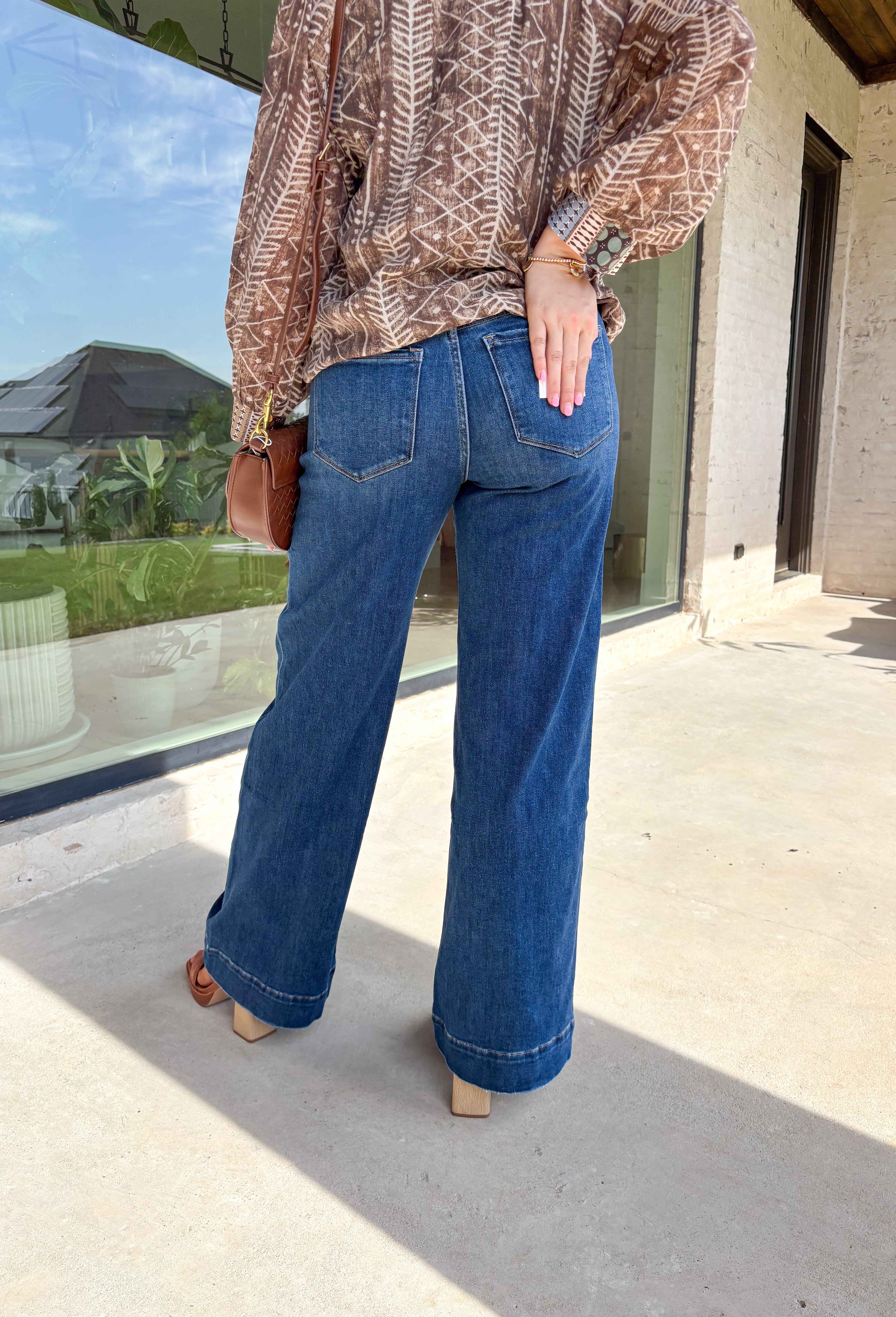 These wide leg jeans are giving instant cool-girl vibes with their luxurious drape and timeless wash. Made from comfort stretch denim, they hug just right at the high rise waist before flowing into an extreme wide leg silhouette that feels both elevated and effortless. The trouser-style hem and full-length inseam create a polished finish that pairs beautifully with boots, sneakers, or heels. In a versatile medium wash, they’re the perfect mix of classic and on-trend for your fall denim lineup.
