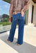 These wide leg jeans are giving instant cool-girl vibes with their luxurious drape and timeless wash. Made from comfort stretch denim, they hug just right at the high rise waist before flowing into an extreme wide leg silhouette that feels both elevated and effortless. The trouser-style hem and full-length inseam create a polished finish that pairs beautifully with boots, sneakers, or heels. In a versatile medium wash, they’re the perfect mix of classic and on-trend for your fall denim lineup.