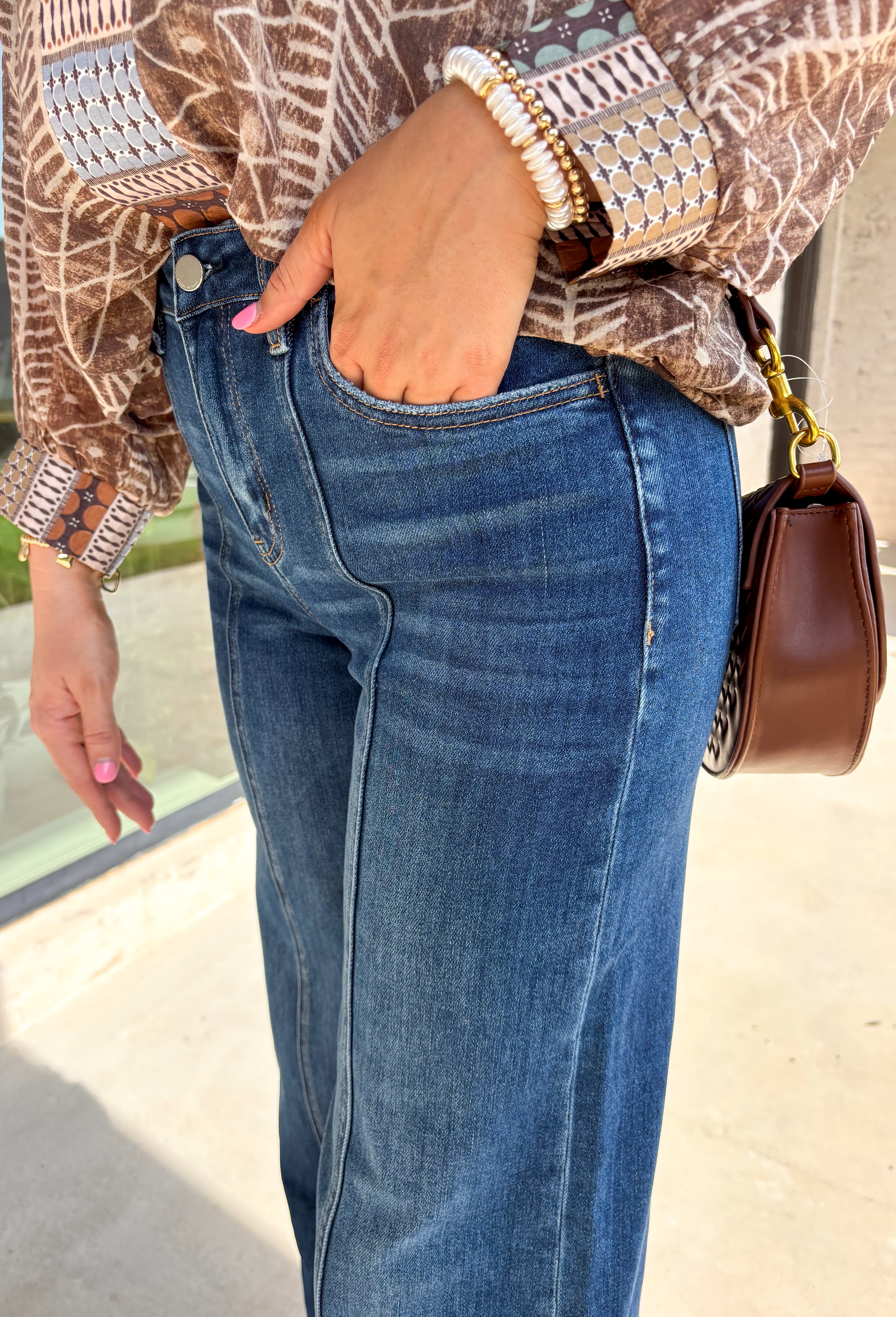 These wide leg jeans are giving instant cool-girl vibes with their luxurious drape and timeless wash. Made from comfort stretch denim, they hug just right at the high rise waist before flowing into an extreme wide leg silhouette that feels both elevated and effortless. The trouser-style hem and full-length inseam create a polished finish that pairs beautifully with boots, sneakers, or heels. In a versatile medium wash, they’re the perfect mix of classic and on-trend for your fall denim lineup.