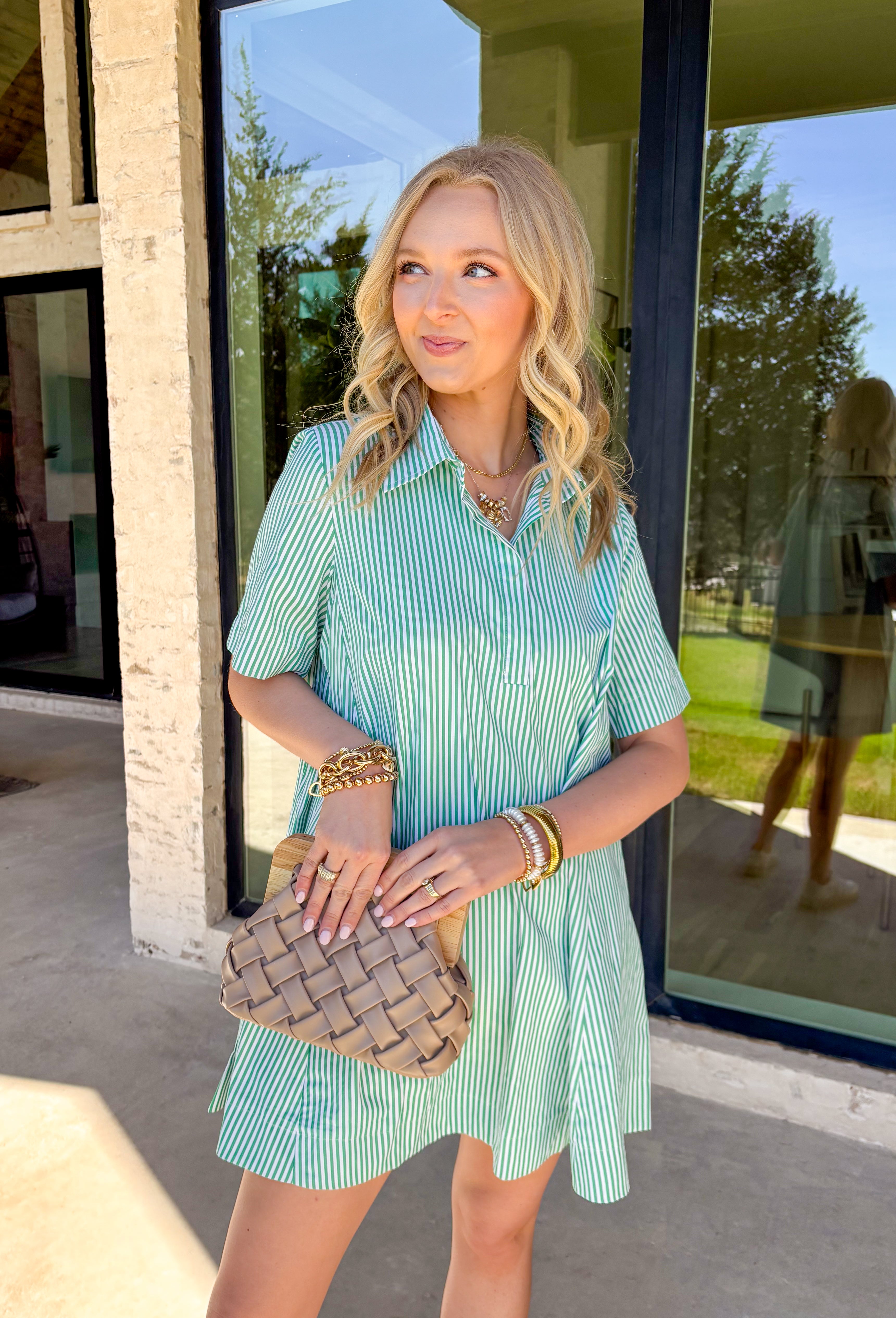 This green and white stripe short sleeve dress is the definition of fresh and effortless. The crisp stripe print gives it that classic, timeless feel, while the collared neckline and front button detail keep it polished and put together. Lightweight and easy to wear, it’s perfect for sunny days, weekend plans, and everything in between. Just throw it on and go — it’s that kind of dress.