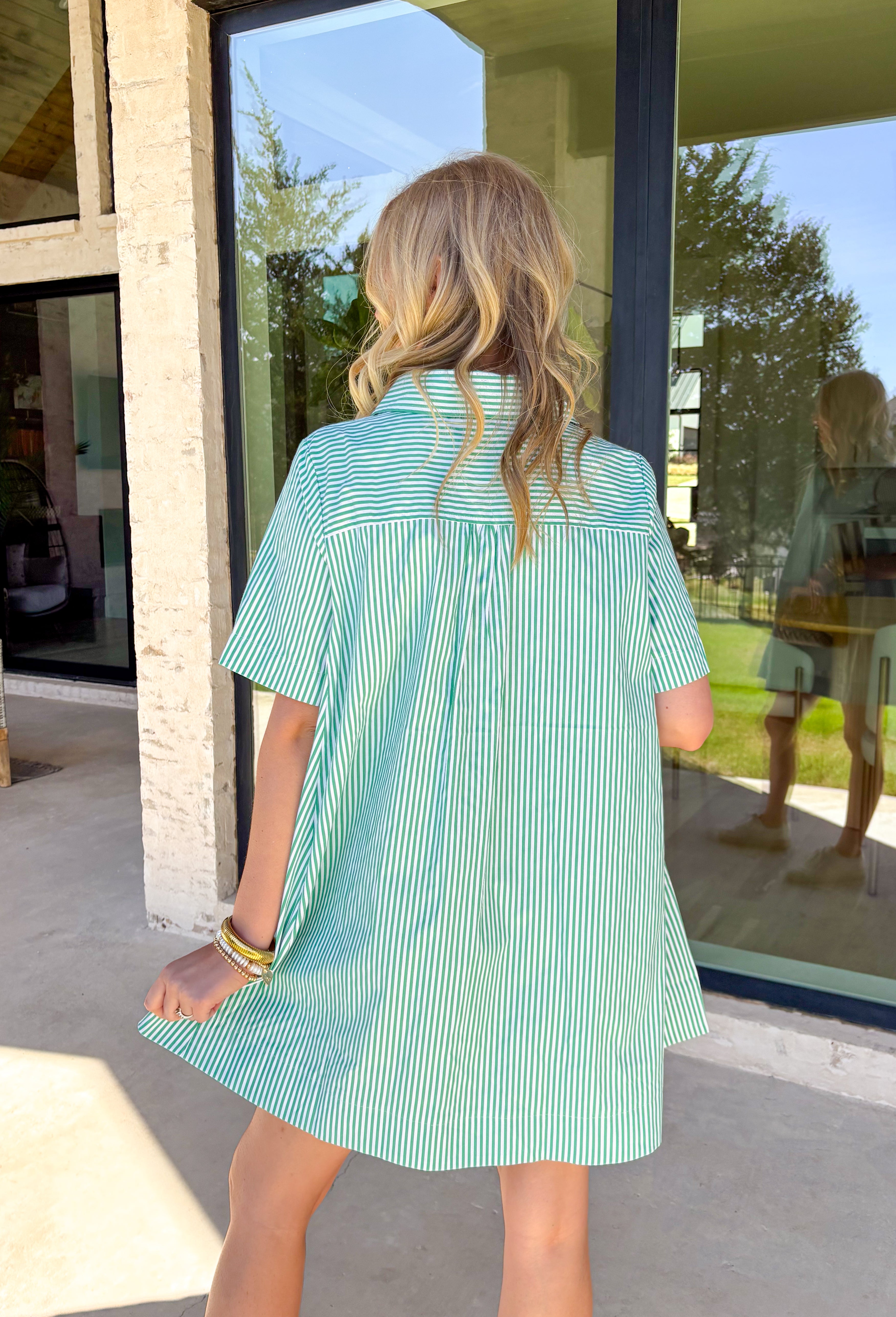 This green and white stripe short sleeve dress is the definition of fresh and effortless. The crisp stripe print gives it that classic, timeless feel, while the collared neckline and front button detail keep it polished and put together. Lightweight and easy to wear, it’s perfect for sunny days, weekend plans, and everything in between. Just throw it on and go — it’s that kind of dress.