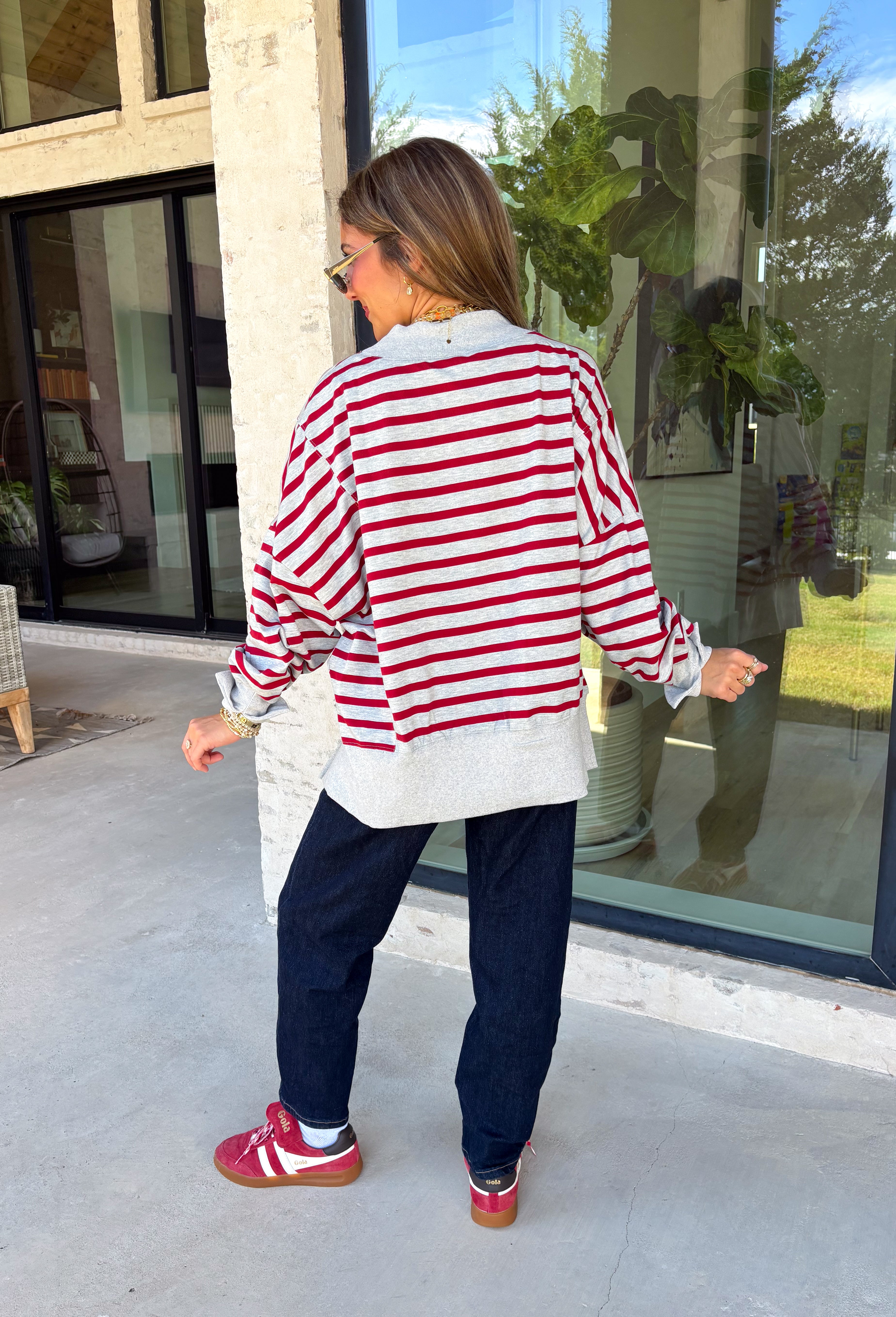 Easy layers are a must as fall starts turning into winter, and this lightweight pullover from Hyfve fits right into the season. The heather grey base is paired with dark red stripes for a cozy color combination that feels especially fitting as the holidays get closer. A mock neckline adds a little extra coverage without making the pullover feel too heavy, making it perfect for those in-between weather days. The soft fabric blend has a touch of stretch for comfortable all-day wear.