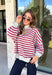 Easy layers are a must as fall starts turning into winter, and this lightweight pullover from Hyfve fits right into the season. The heather grey base is paired with dark red stripes for a cozy color combination that feels especially fitting as the holidays get closer. A mock neckline adds a little extra coverage without making the pullover feel too heavy, making it perfect for those in-between weather days. The soft fabric blend has a touch of stretch for comfortable all-day wear.