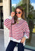 Easy layers are a must as fall starts turning into winter, and this lightweight pullover from Hyfve fits right into the season. The heather grey base is paired with dark red stripes for a cozy color combination that feels especially fitting as the holidays get closer. A mock neckline adds a little extra coverage without making the pullover feel too heavy, making it perfect for those in-between weather days. The soft fabric blend has a touch of stretch for comfortable all-day wear.