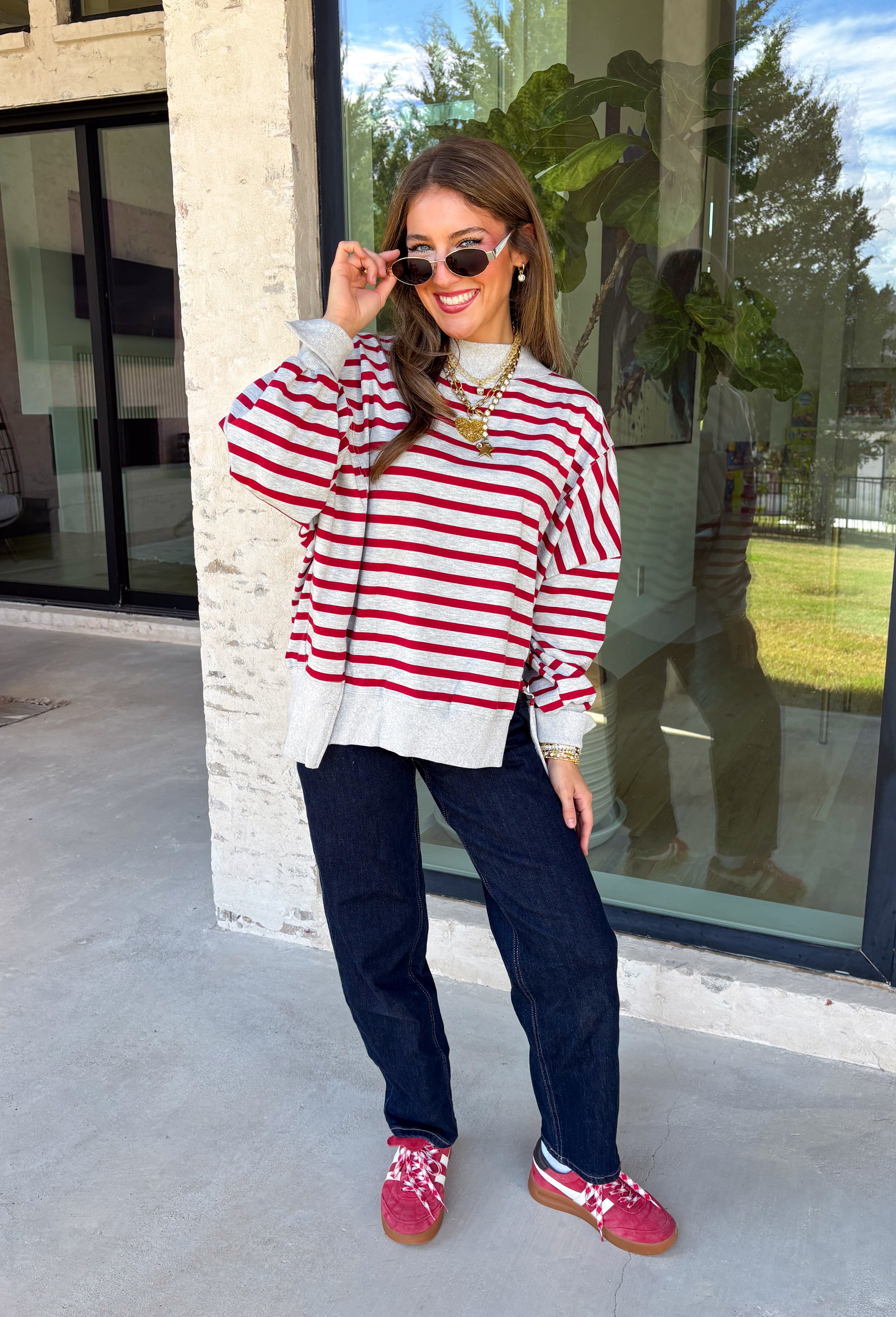Easy layers are a must as fall starts turning into winter, and this lightweight pullover from Hyfve fits right into the season. The heather grey base is paired with dark red stripes for a cozy color combination that feels especially fitting as the holidays get closer. A mock neckline adds a little extra coverage without making the pullover feel too heavy, making it perfect for those in-between weather days. The soft fabric blend has a touch of stretch for comfortable all-day wear.