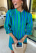 Fresh stripes and easy details make this green and blue dress by Entro a spring must-have. Designed with a striped pattern, it features ¾ length puff sleeves that add a playful, feminine touch. The ruffled band collar and partial button-front closure give it a polished feel, while the self-tie at the back waist creates a flattering, adjustable fit. Fully lined for comfort, this dress is perfect for spring days when you want something effortless, cute, and ready to go.