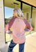 This blush long sleeve top by New In is a playful mix of prints and cozy comfort. The split neckline keeps the silhouette casual, while the sleeves bring in unexpected detail with burgundy stripes paired against gray and pink florals. Made from 100% cotton, it’s lightweight, breathable, and perfect for easy layering through the season.