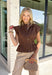 Elevate your everyday wardrobe with this utility-inspired top that perfectly blends style and function. Crafted in a rich chocolate brown hue, this versatile piece features a modern snap button-front with a hidden zipper closure for a polished, elevated look. The elastic waist creates a flattering silhouette while keeping the fit comfortable and easy to wear. 