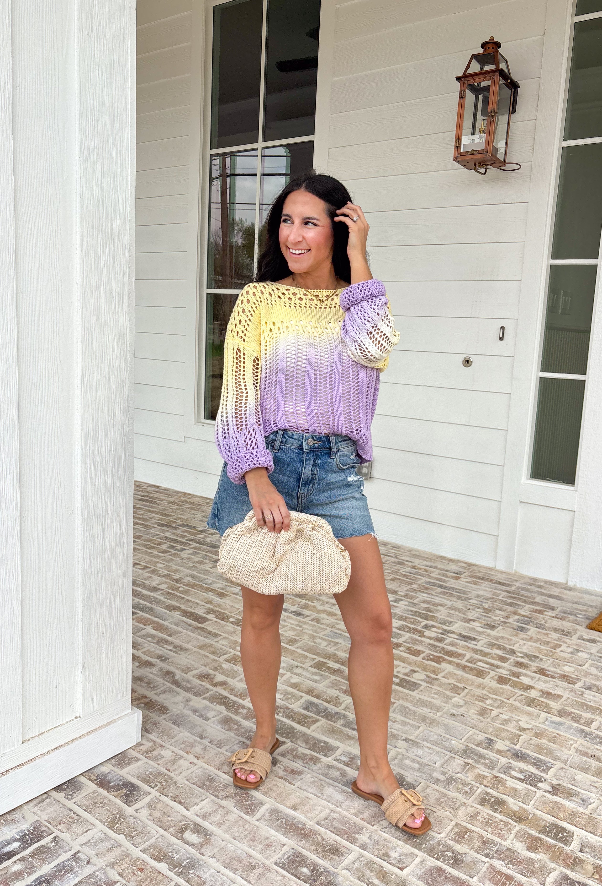 Soft, dreamy, and made for sunshine-filled days, this open knit sweater blends butter yellow and light purple in the prettiest ombré effect. The gradual color fade feels light and airy — perfect for bright spring mornings and breezy evenings. The open knit design gives it a breathable, relaxed feel while still offering cozy texture. Crafted from 100% cotton, it’s lightweight enough to layer now and wear on its own as temperatures warm up. 