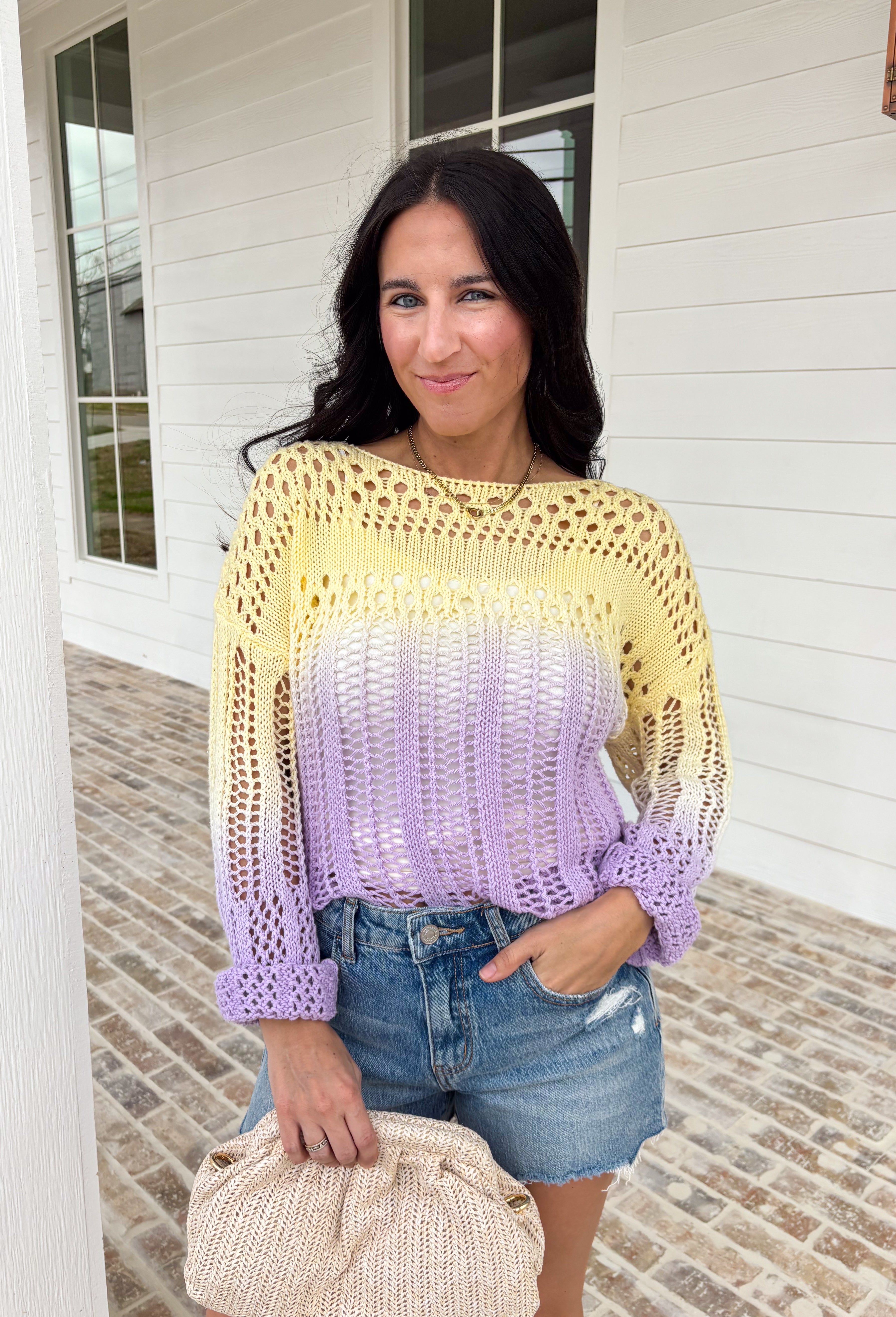 Soft, dreamy, and made for sunshine-filled days, this open knit sweater blends butter yellow and light purple in the prettiest ombré effect. The gradual color fade feels light and airy — perfect for bright spring mornings and breezy evenings. The open knit design gives it a breathable, relaxed feel while still offering cozy texture. Crafted from 100% cotton, it’s lightweight enough to layer now and wear on its own as temperatures warm up. 