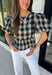Nothing says fall quite like classic plaid! This black and tan plaid top brings timeless autumn style with a flattering structured babydoll silhouette that's easy to dress up or down. Feminine puff sleeves add a charming touch, while the back zipper closure creates a polished fit. Crafted from a breathable cotton blend, it's the perfect top for everything from pumpkin patch adventures and weekend brunches to casual office days and family gatherings.