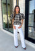 Nothing says fall quite like classic plaid! This black and tan plaid top brings timeless autumn style with a flattering structured babydoll silhouette that's easy to dress up or down. Feminine puff sleeves add a charming touch, while the back zipper closure creates a polished fit. Crafted from a breathable cotton blend, it's the perfect top for everything from pumpkin patch adventures and weekend brunches to casual office days and family gatherings.
