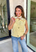 A cheerful pop of color for your fall wardrobe, this butter yellow sweater vest is both cozy and chic. Designed with a button-front closure, each hammered gold button adds a touch of shine and texture against the soft knit. The sleeveless silhouette makes it perfect for layering over blouses, dresses, or turtlenecks, giving you endless styling options as the weather cools. Lightweight with just the right amount of stretch, it’s a versatile piece that will brighten up your seasonal staples.