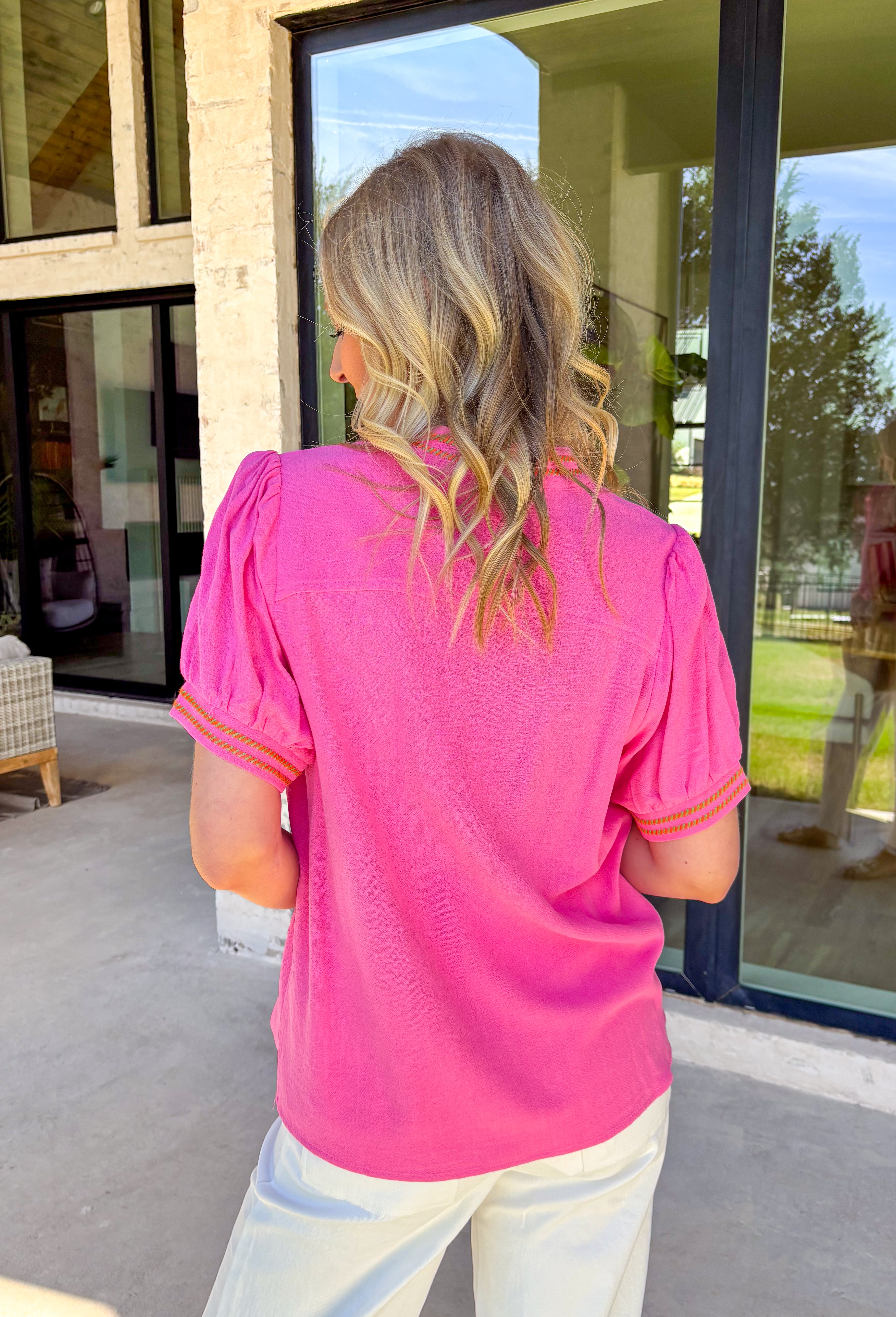 This short sleeve pink top by Umgee is the perfect little pop of spring color! The green and orange embroidered trim along the neckline and sleeve cuffs adds such a fun, cheerful detail—like a tiny burst of sunshine built right into your outfit. The flattering v-neckline keeps it easy and effortless, while the linen blend fabric feels lightweight and breathable for warmer days ahead. 