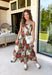 Beautifully feminine and full of rich seasonal color, this floral midi dress is a timeless addition to your fall wardrobe. Designed in a stunning dark teal hue with a gorgeous floral print in warm autumn shades, this dress is perfect for everything from family photos to holiday gatherings. The straight neckline and pleated bodice create an elegant, flattering silhouette, while the adjustable straps and smocked back provide a comfortable, customizable fit. 