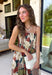 Beautifully feminine and full of rich seasonal color, this floral midi dress is a timeless addition to your fall wardrobe. Designed in a stunning dark teal hue with a gorgeous floral print in warm autumn shades, this dress is perfect for everything from family photos to holiday gatherings. The straight neckline and pleated bodice create an elegant, flattering silhouette, while the adjustable straps and smocked back provide a comfortable, customizable fit. 