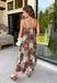 Beautifully feminine and full of rich seasonal color, this floral midi dress is a timeless addition to your fall wardrobe. Designed in a stunning dark teal hue with a gorgeous floral print in warm autumn shades, this dress is perfect for everything from family photos to holiday gatherings. The straight neckline and pleated bodice create an elegant, flattering silhouette, while the adjustable straps and smocked back provide a comfortable, customizable fit. 
