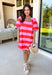 This pink and red striped mini dress by Entro is the definition of fun spring style. The bold stripe print makes a statement all on its own, while the short puff sleeves add that sweet, feminine touch we love. With a button-front design, it feels classic and easy to wear—perfect for those days when you want to look cute without having to think too hard about it.
