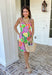 This sleeveless floral dress is bringing all the color and all the confidence. Featuring a bold mix of purple, orange, green, yellow, pink, and white, this beauty is made to stand out in the best way. The scalloped neckline and hem add the sweetest feminine touch, while the fabric-covered knotted bead straps give it that extra detail that feels fun and elevated. Designed with smocking along the back for a comfortable, flattering fit, this fully lined cotton dress is as easy to wear as it is eye-catching. 